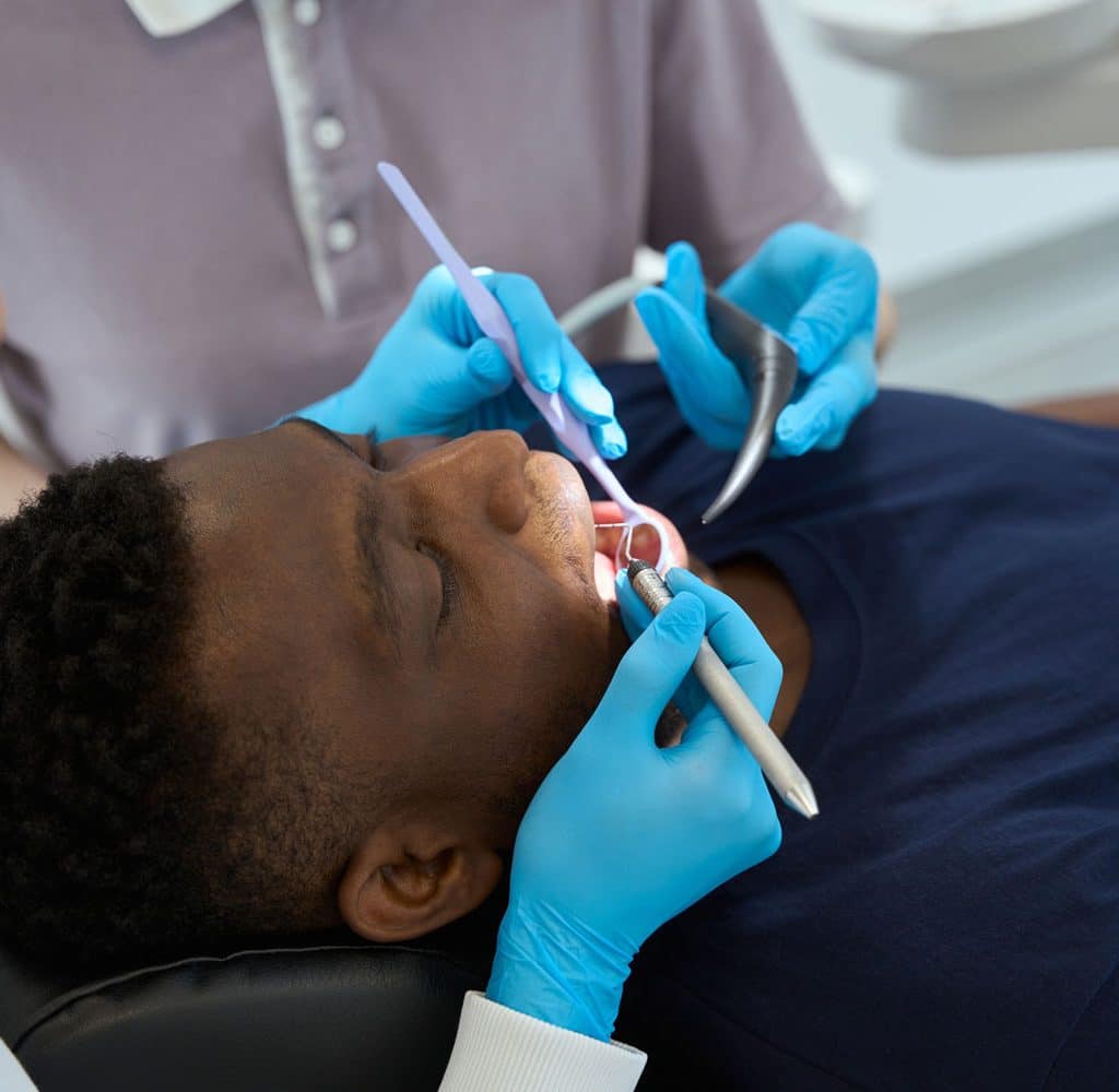 nurse-assisting-to-female-odontolog-during-teeth-t-2023-11-27-05-34-48-utc
