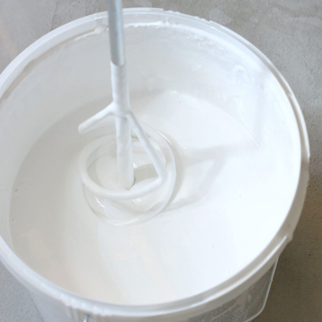 white-paint-in-bucket-on-the-floor-2023-11-27-05-20-17-utc